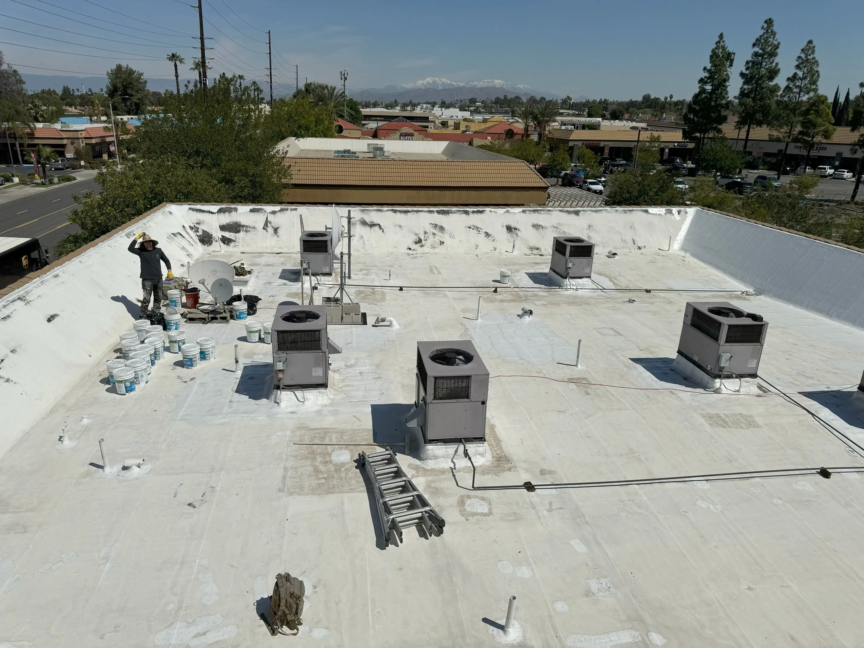 Commercial flat roof before silicone restoration coating was applied
